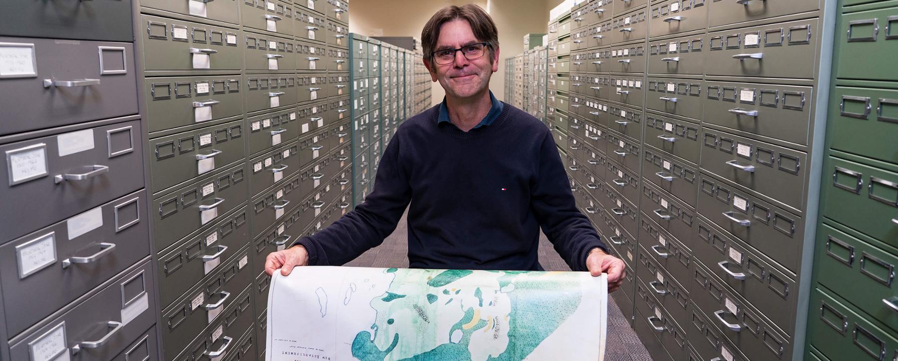 John Lutz in the map room at UVic Library.