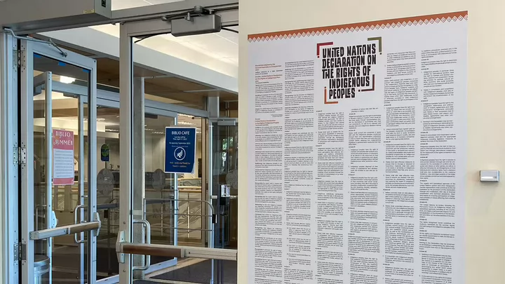 UNDRIP poster hanging on the wall of the BiblioCafe