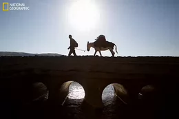 National Geographic Explorer Paul Salopek crosses a bridge while walking through remote regions near Nemrut in eastern Turkey.