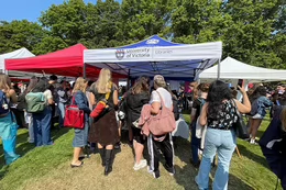 Students in front of the UVic Libraries tent