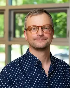 Headshot of librarian research associate Christian Schmidt.