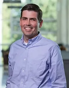 Headshot of collection management services director Den Seeman