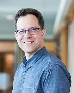 Headshot of library systems head John Durno.