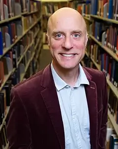 Headshot of librarian Justin Harrison.