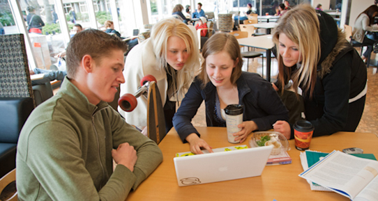 Students working on a group project in the BiblioCafé.