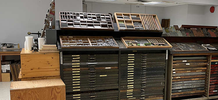Section of the Farallon Book Arts Lab showing several trays of typesetting equipment.