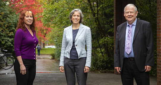 Deborah, Calvin and Holly standing outside UVic law building
