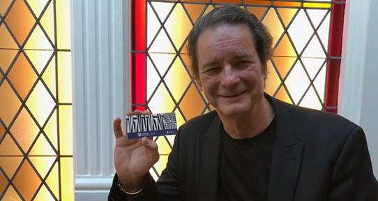 Writer David Day holds a library community card