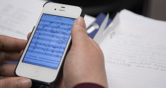 image of student viewing musical score on a mobile device