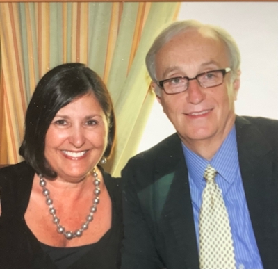 Colour portrait of Ana and Peter Lowens dressed formally