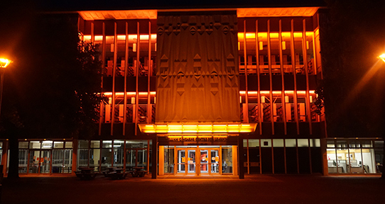 Library lit orange in front 