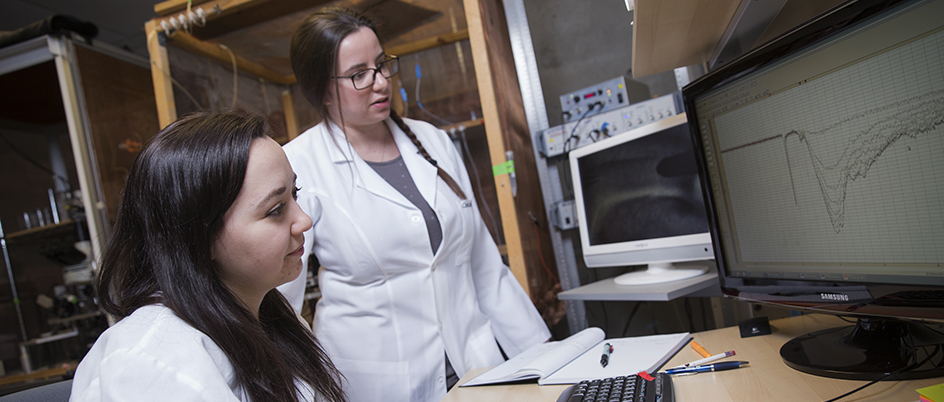 Two people working in a medical sciences lab