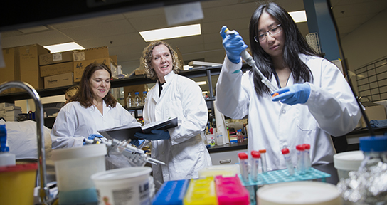 Dr. Leigh Anne Swayne and lab staff