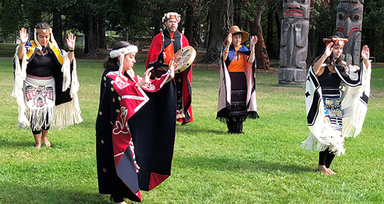 Salish dancers perfom as part of a video for Orange Shirt Day.