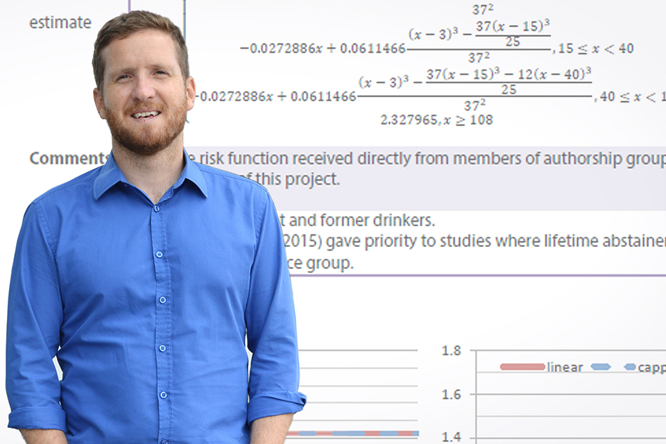 Adam Sherk in front of equations