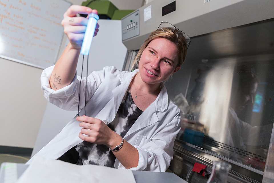 Paige Whitehead holding up a demo Nyoka Light Wand