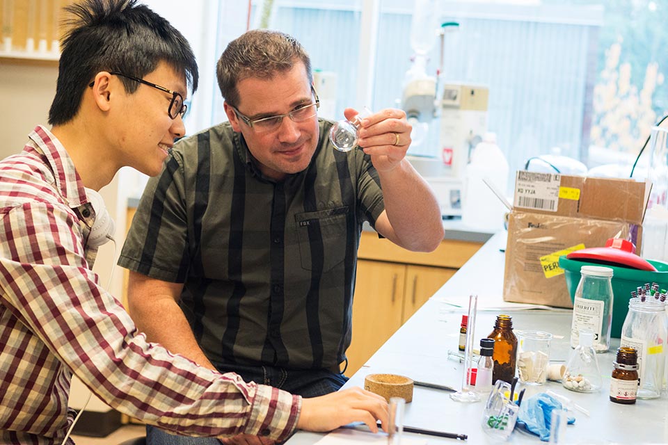 Chemist Jeremy Wulff with now-graduated PhD student Jun Chen