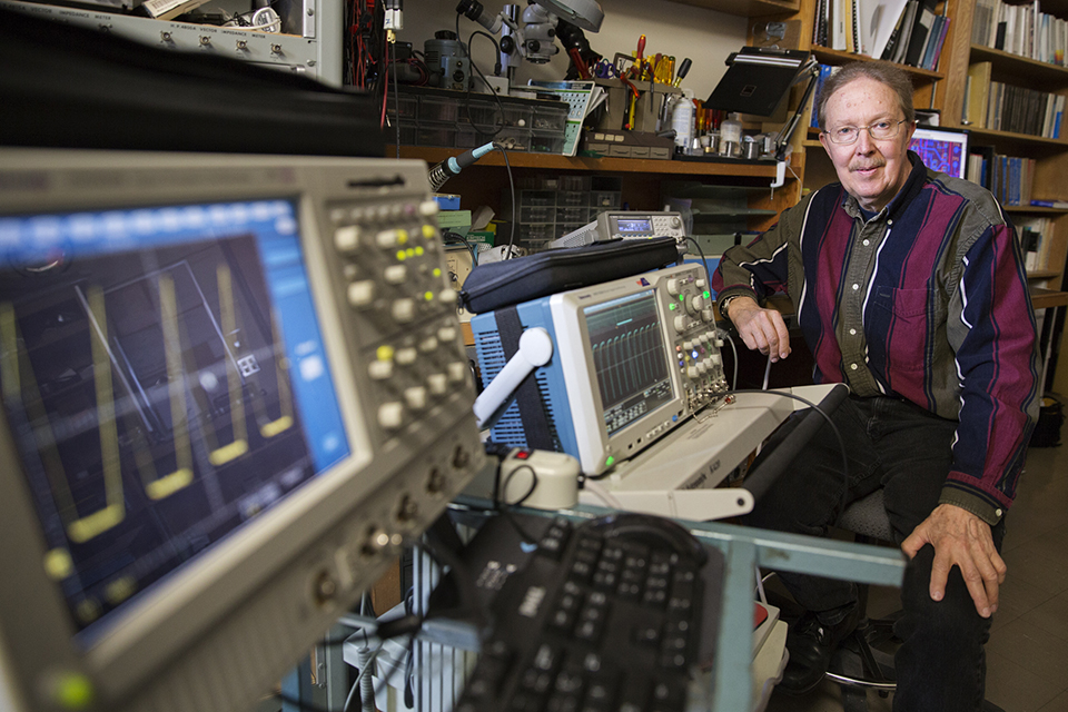 Honkanen in a lab with a computer