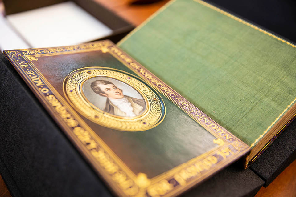 A book cover showing a portrait from one of the donated books.