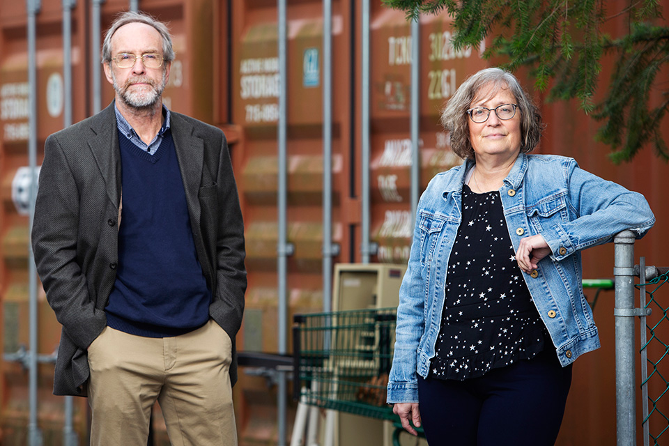 UVic researchers Tim Stockwell and Bernie Pauly by shipping containers