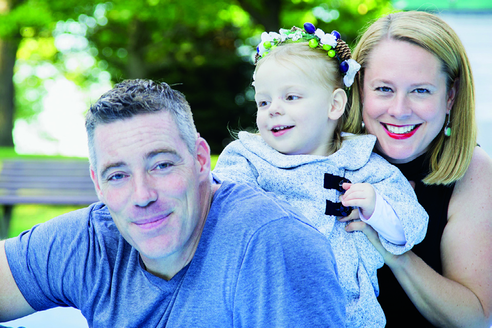 Photo of Tony Giovando and his smiling wife and daughter in Ottawa