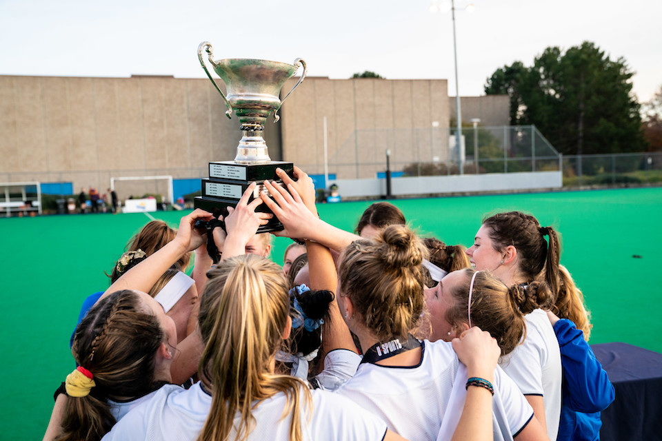 Players hoist a trophy in celebration