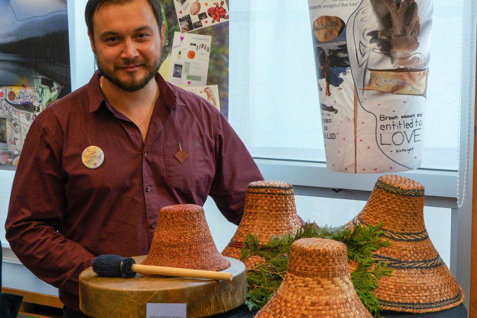 Keenan Andrew with a selection of woven cedar hats