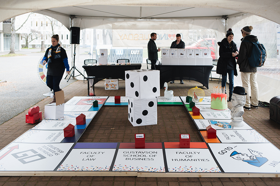 A life-size board game at the anuual Giving Tuesday drive