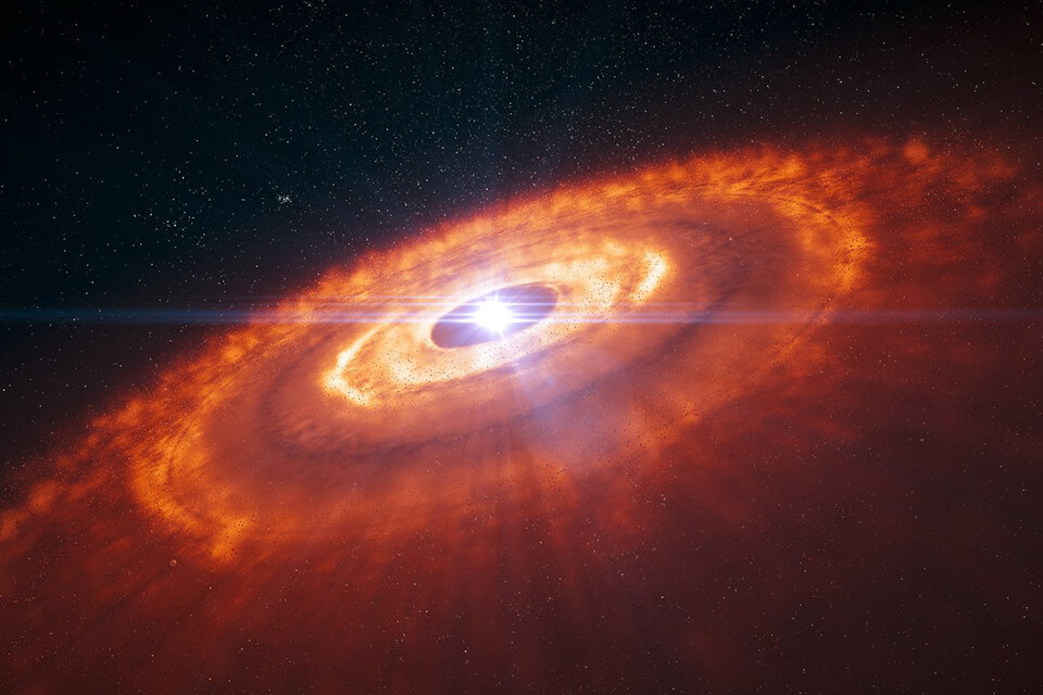 Young star surrounded by a protoplanetary disc in 