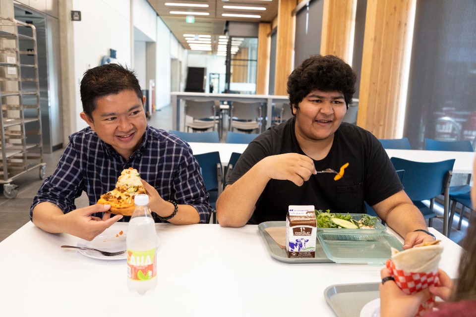 Two students in Cove dining hall.