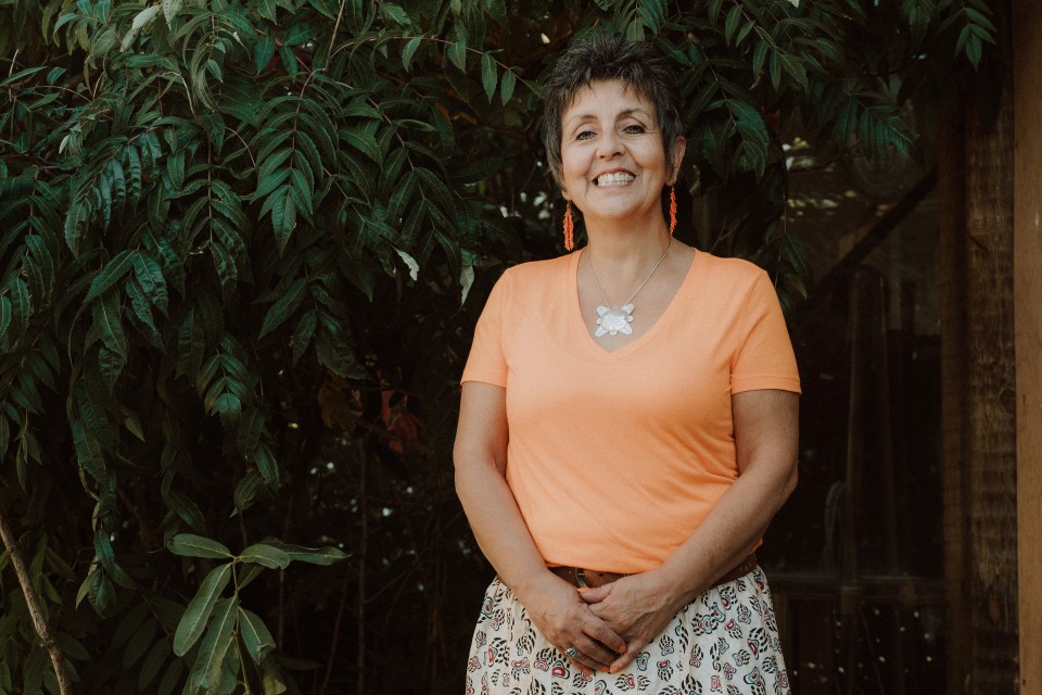Lisa Bourque Bearskin stands outside smiling