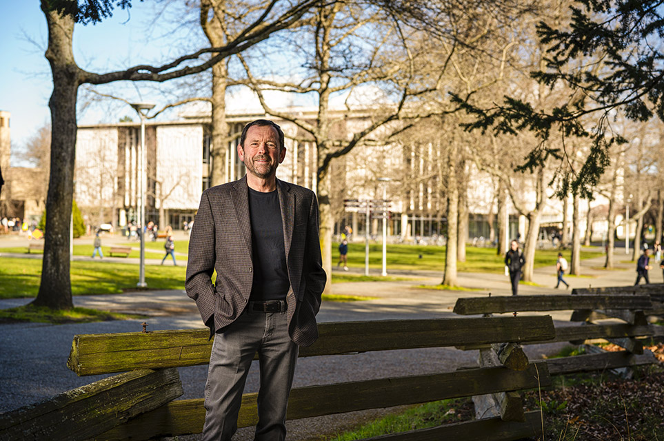 Jamie Cassels stands on campus