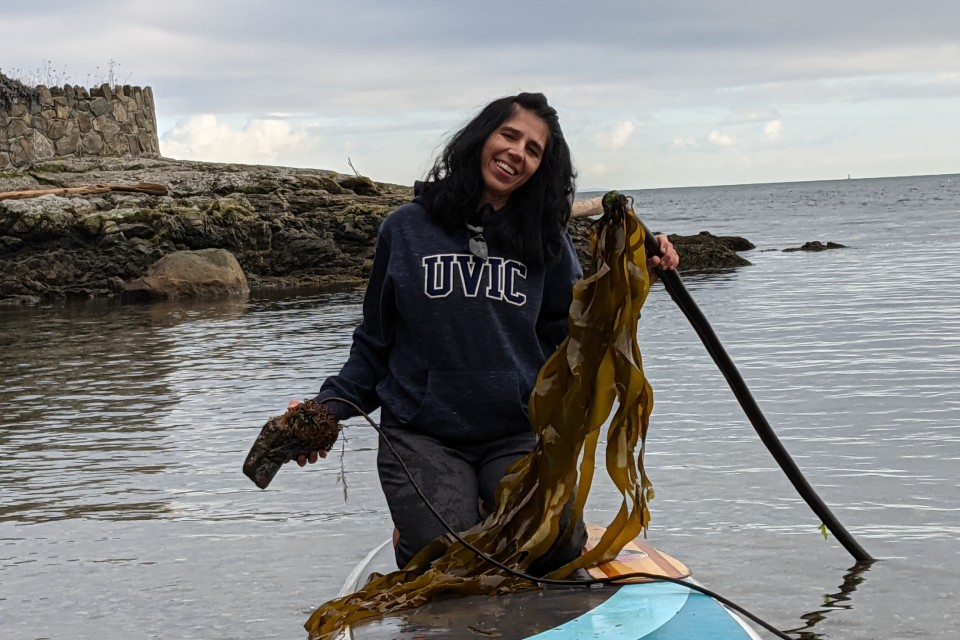 Geographer Maycira on standup paddle board