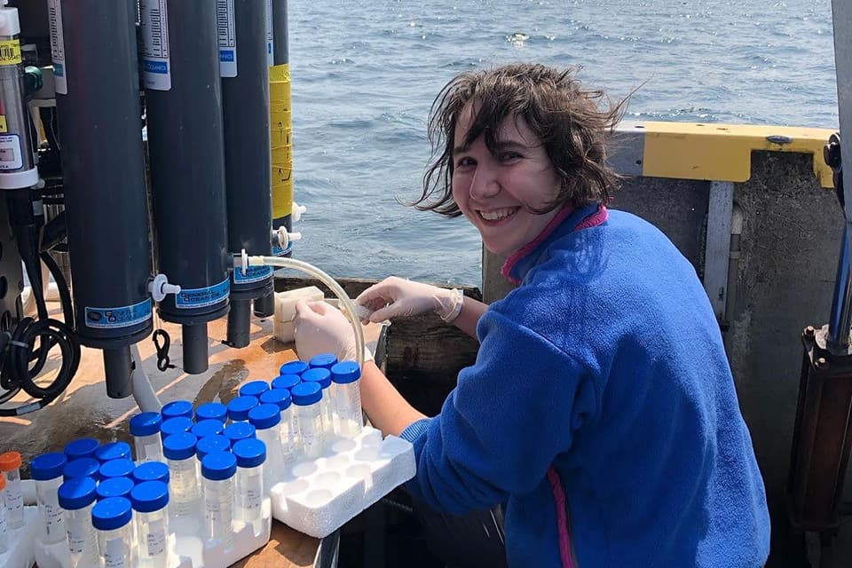 Meghan Molnar collecting samples aboard the MSV John Strickland