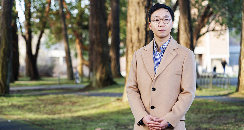Mantou Lou smiles at camera from centre of UVic quad