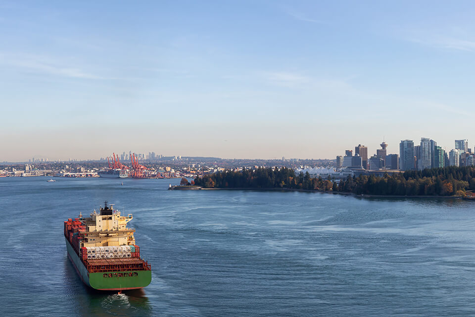 A shipping container enters the Port of Vancouver.