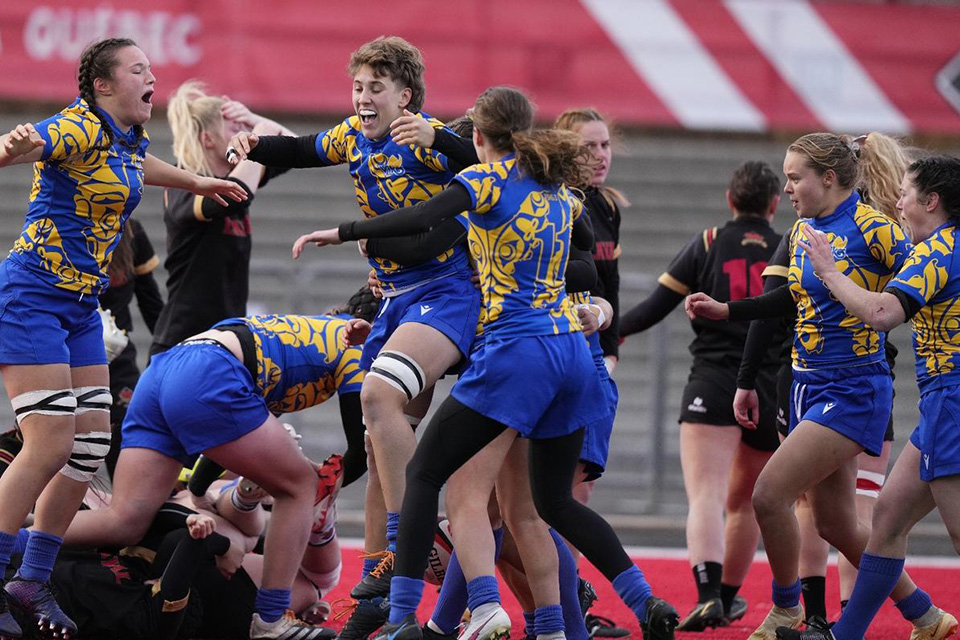 Players from the UVic women's rugby team celebrate winning a national silver medal