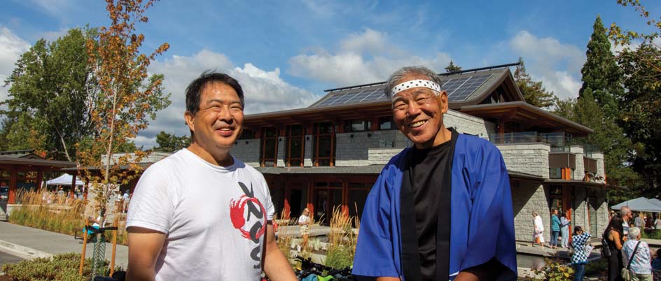 Two people stand in front of Esquimalt’s new pavilion.