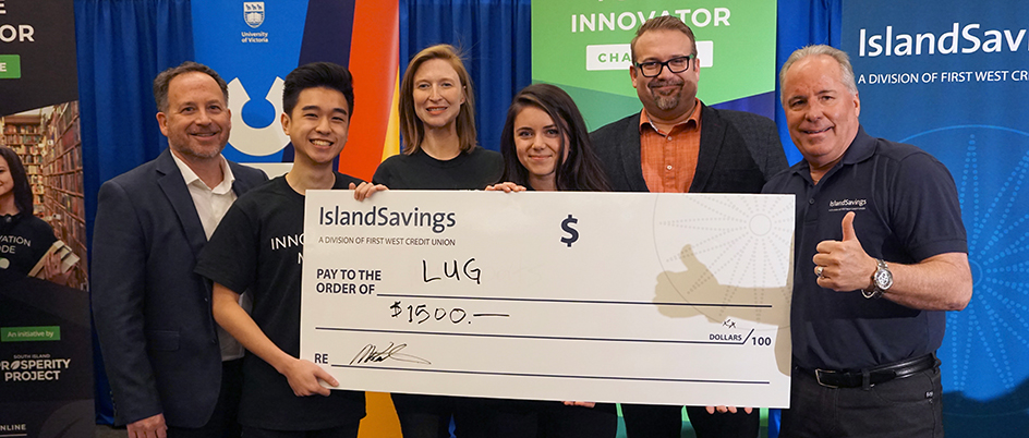 Gustavson team holding a giant cheque