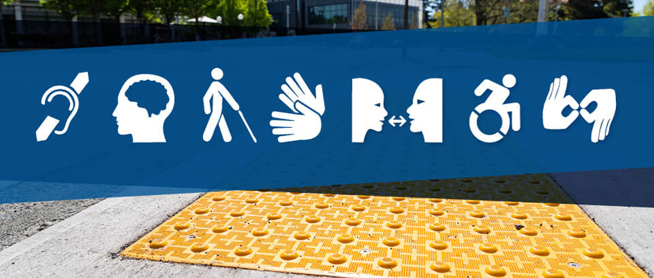 A blue banner with accessibility-related icons cross over an accessible crosswalk at UVic.