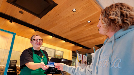Guest using their Guest Card in Starbucks