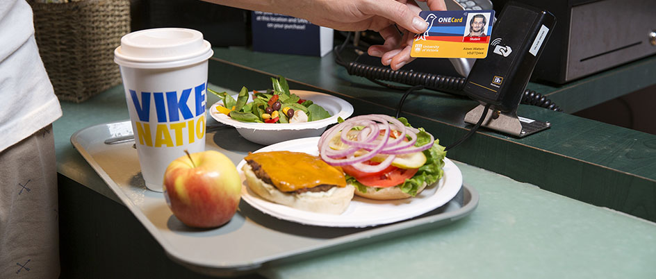 A UVic student pays for a meal with his ONECard.
