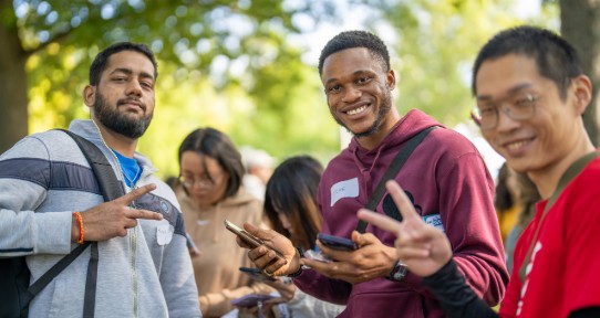Four students smiling and posing for the camera.