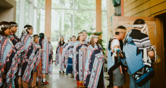 Ceremonial procession in First Peoples House