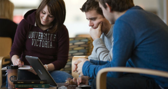 Students working around a computer