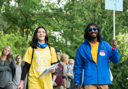 Two volunteers for UVic Orientation leading a group of new students