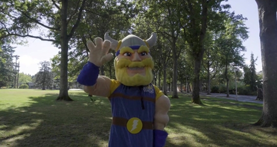 Thunder standing on the quad waving