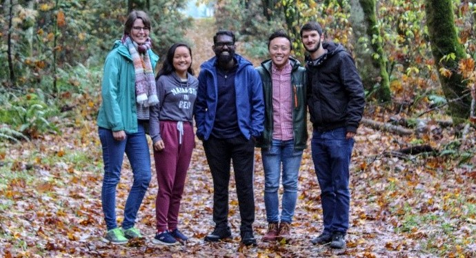 5 students in a forest during fall