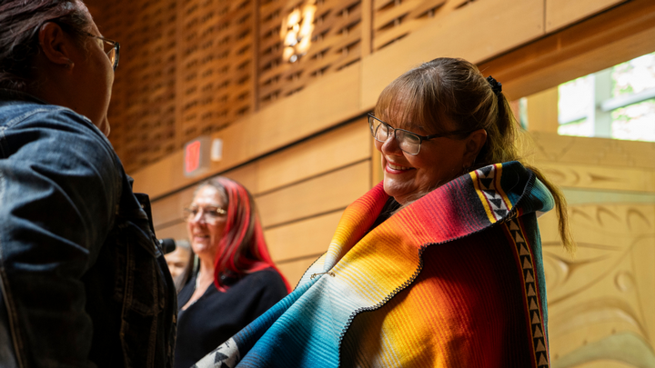 Lalita wrapped in a blanket