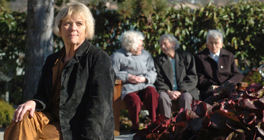 Gallagher with women in the community